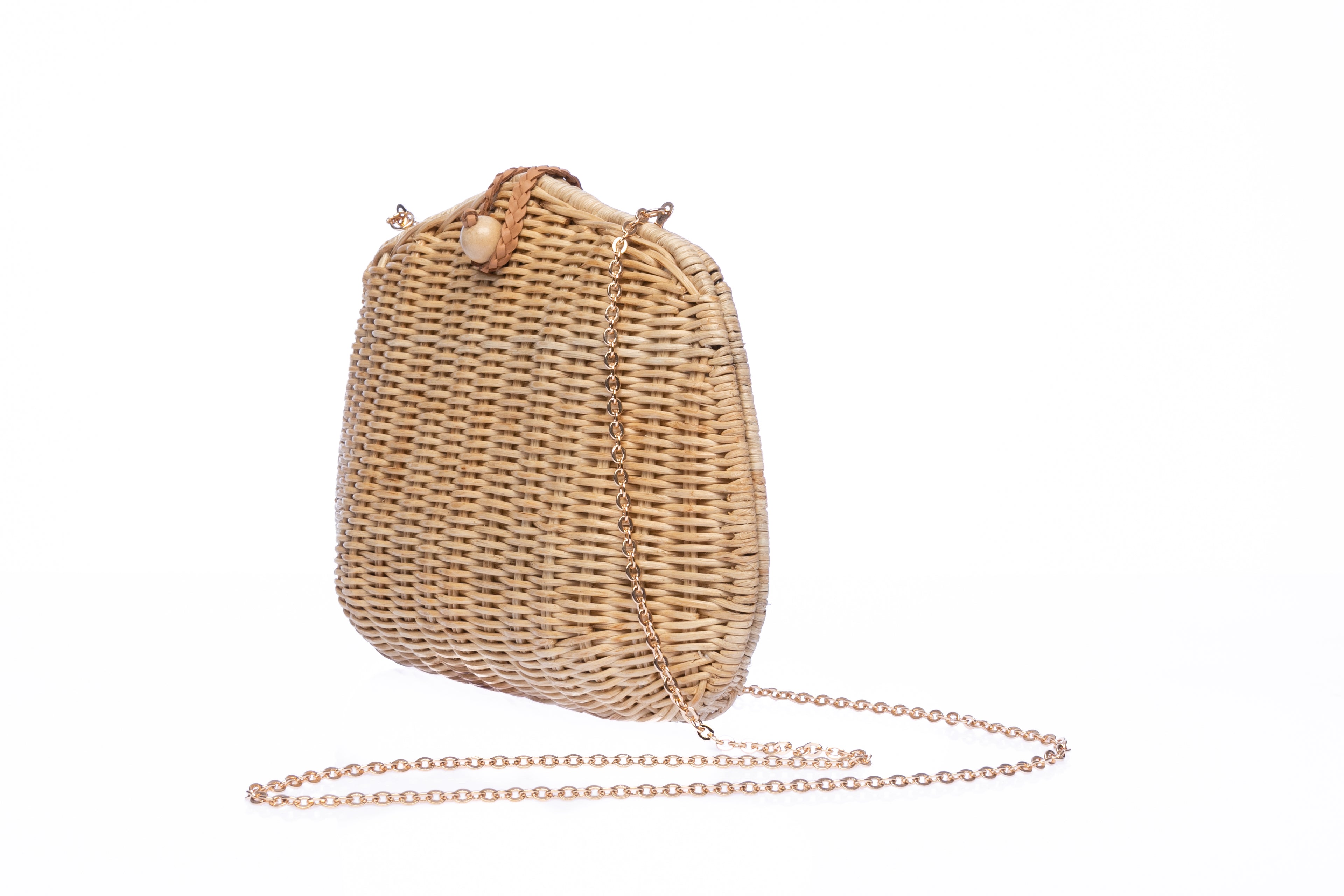 Stephanie Wicker Clutch made from handwoven rattan with a removable brass chain strap, perfect for day or night wear.