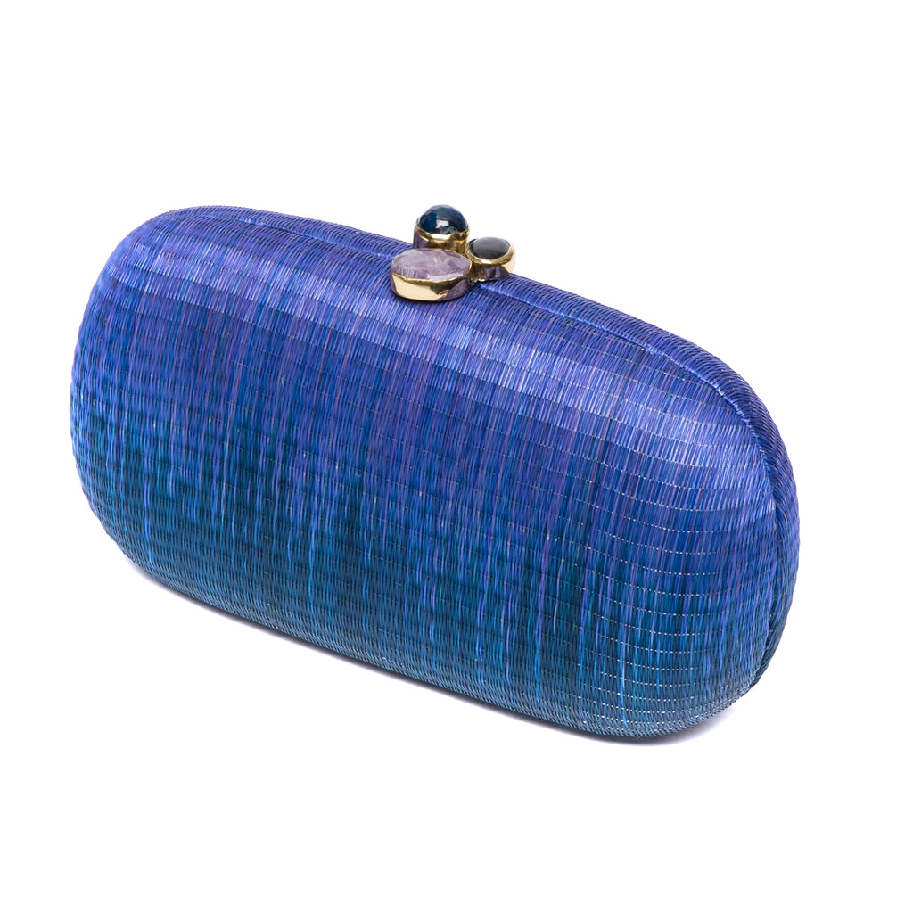 Still Waters Oval Hard Case Purse, handwoven from Buri plant fibers with agate stone accents and a brass chain strap for versatile carrying options.