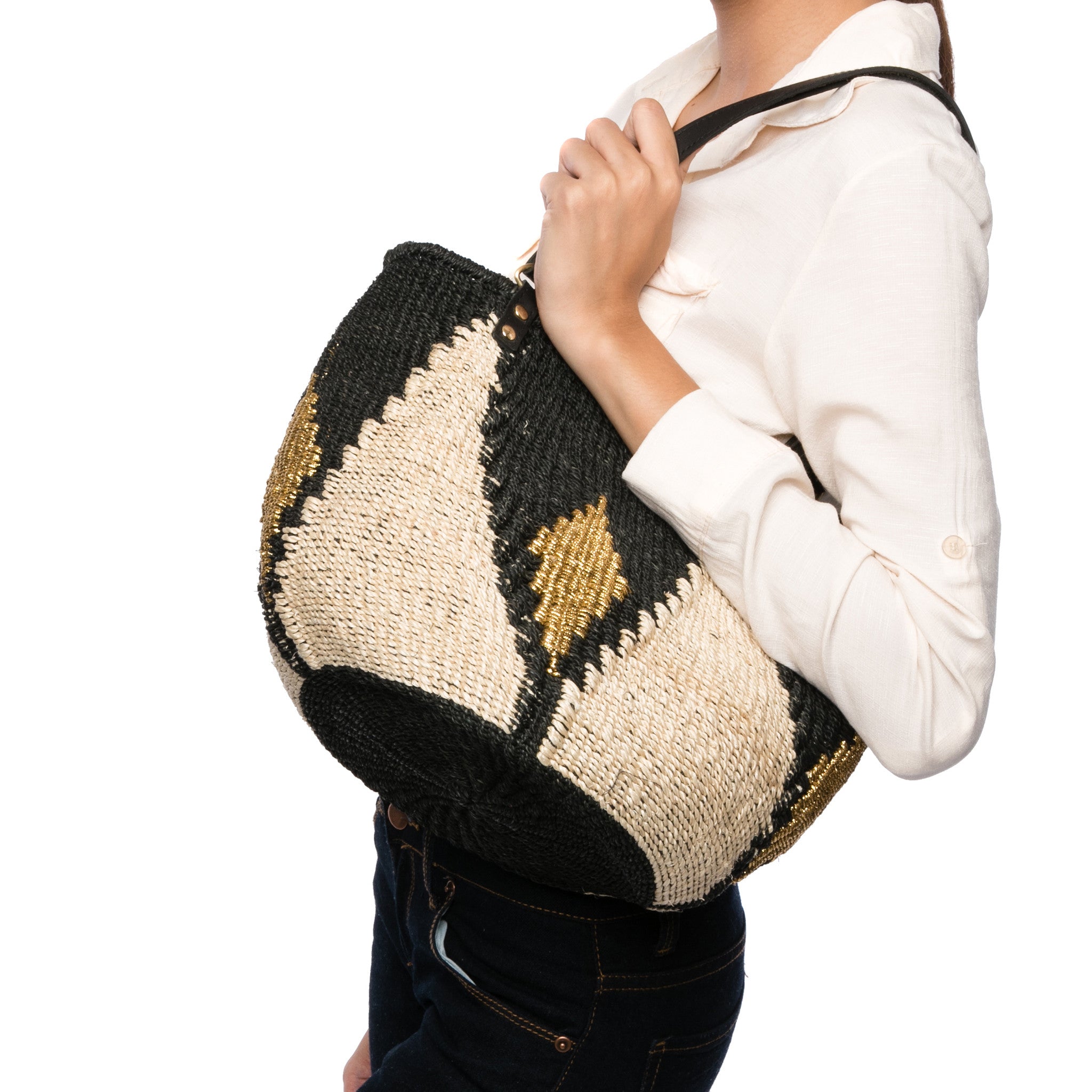 Sunset Rae Tote made from natural plant fibers and gold polyester cord with leather handles, offering a stylish and sustainable option for daily use.