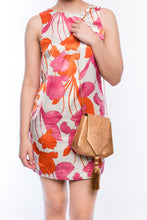 Load image into Gallery viewer, Bronze Glory Shoulder Bag with handwoven natural plant fibers, gold tassel, and brass chain strap. Sustainable and elegant design.
