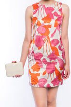 Load image into Gallery viewer, Iris White Woven Clutch made from sustainable plant fibers, featuring a bold red stone accent, brass drop-in chain strap, and fully lined interior for an eco-friendly yet elegant look.
