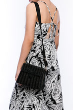 Load image into Gallery viewer, Adie wicker black shoulder bag, handwoven from sustainable rattan with a cotton strap and brass hardware, perfect for eco-conscious style.
