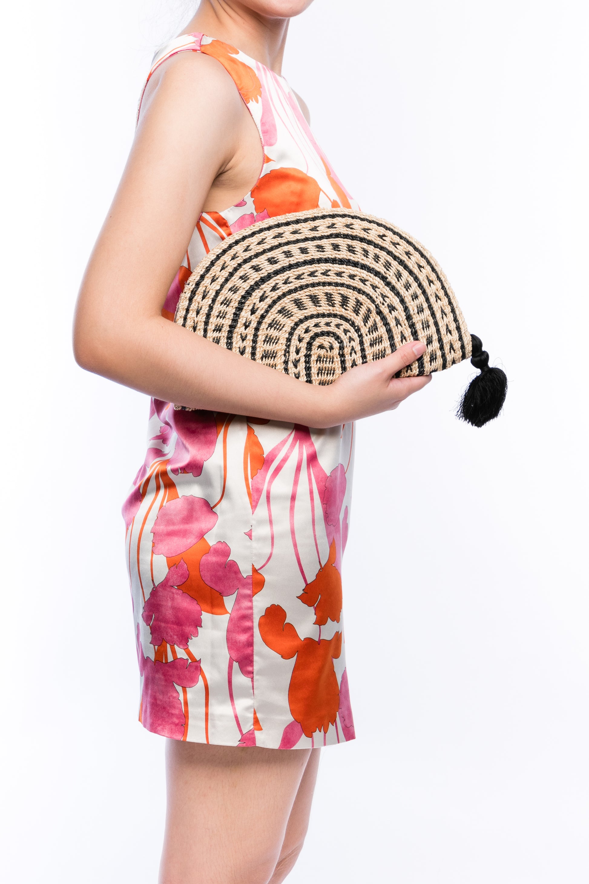 Tiffany Fan Clutch made from 100% abaca, handwoven with eco-friendly craftsmanship, featuring a sleek design and sustainable materials.