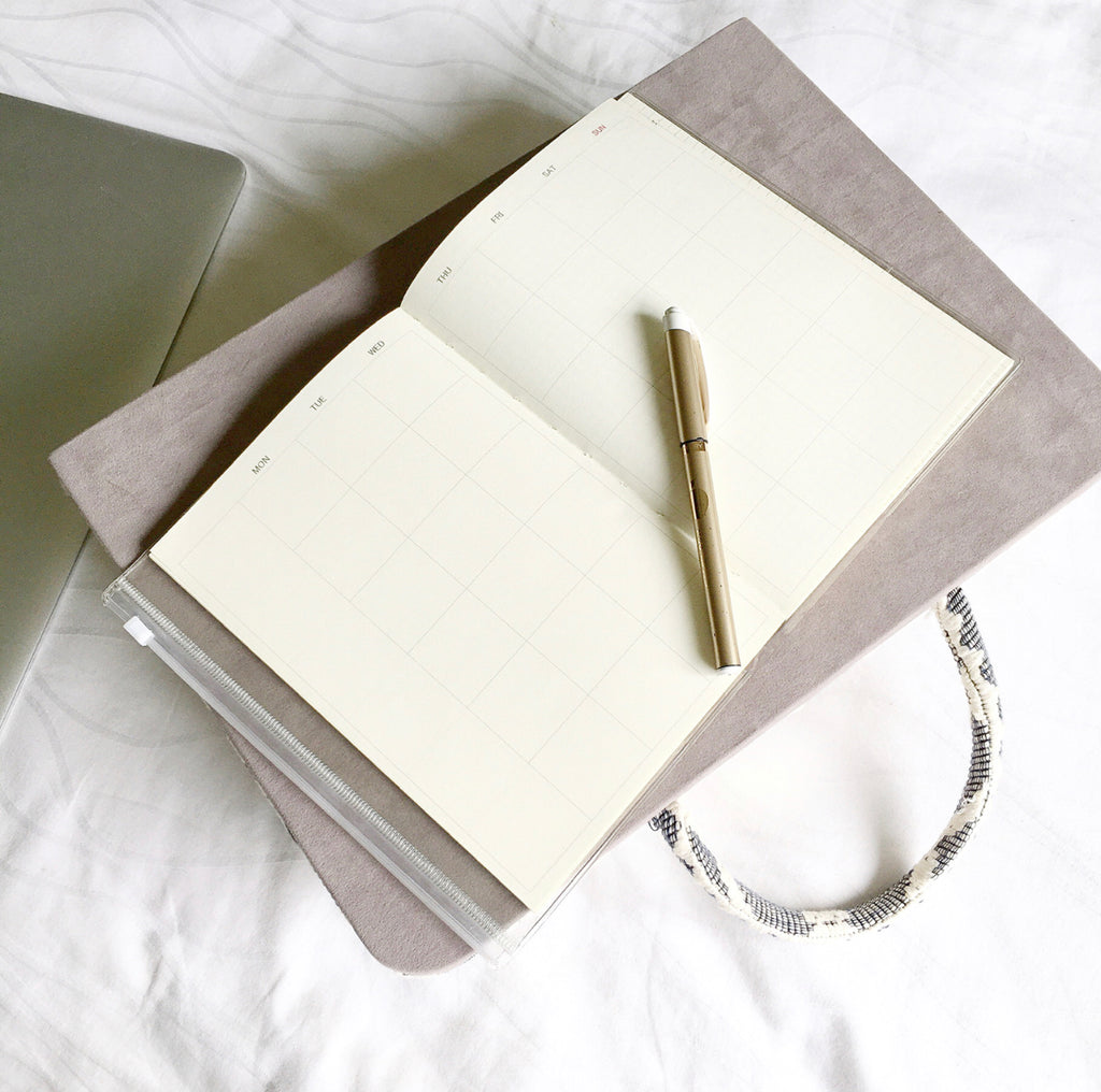 Hazel Inabel Laptop Pillow made from traditional Abel Iloco handloomed fabric with a faux suede non-slip top and convenient handle for easy portability.