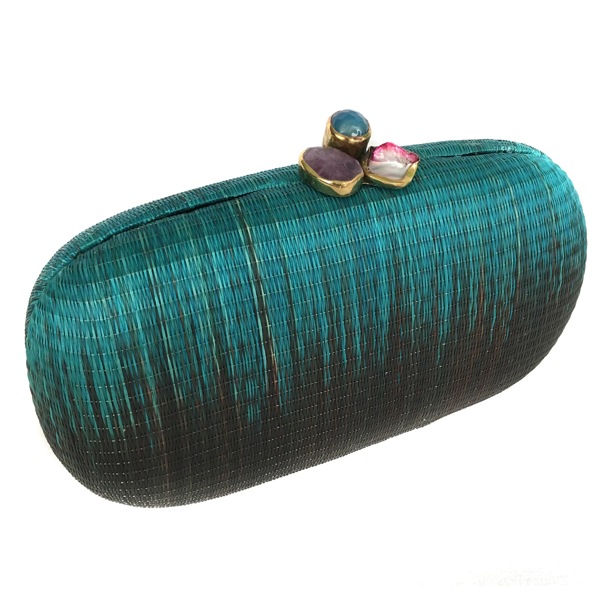Turquoise Dream Oval Hard Case Purse made from handwoven Buri fiber, adorned with agate stones and brass accents, with a versatile drop-in brass chain for carrying as a clutch or shoulder bag.