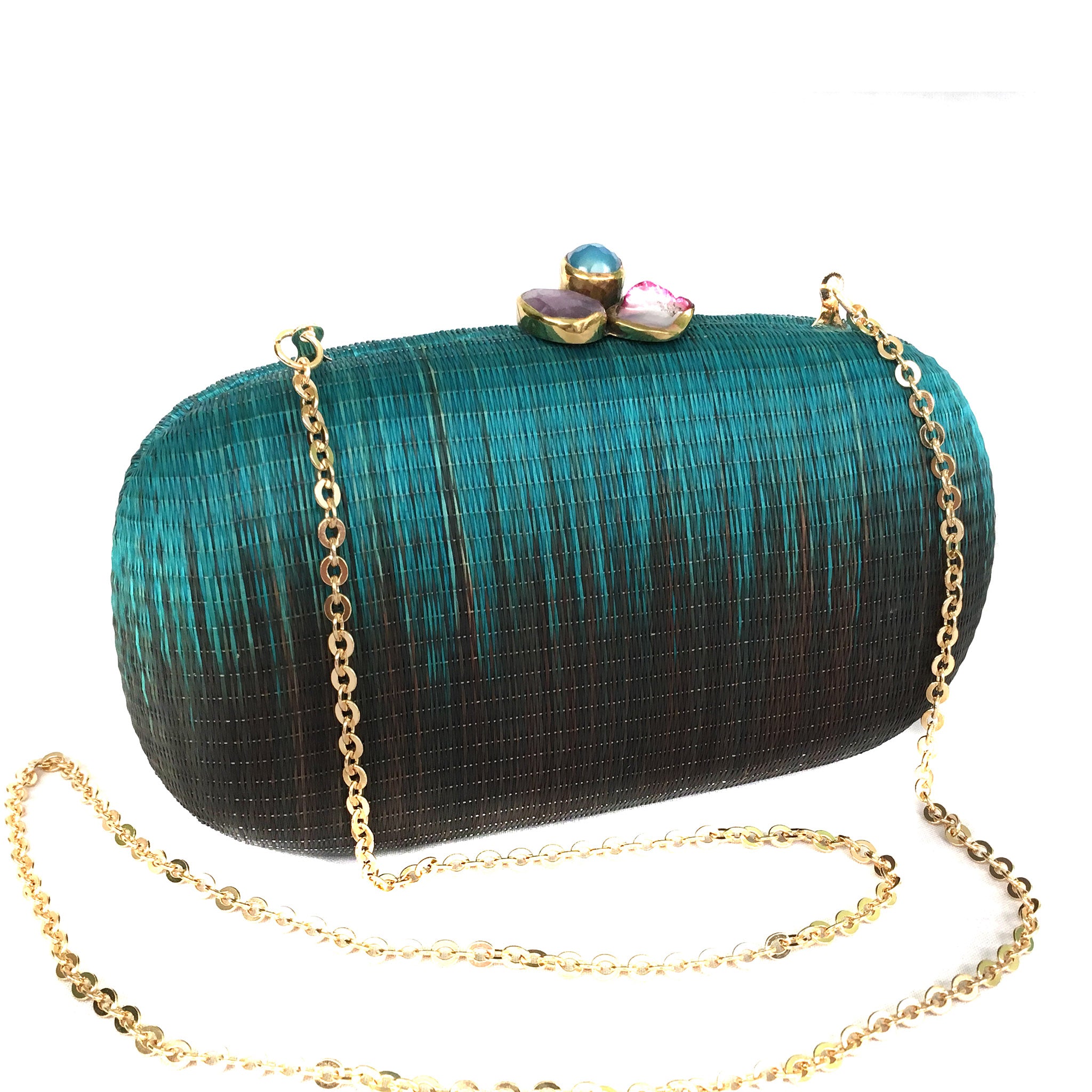 Turquoise Dream Oval Hard Case Purse made from handwoven Buri fiber, adorned with agate stones and brass accents, with a versatile drop-in brass chain for carrying as a clutch or shoulder bag.