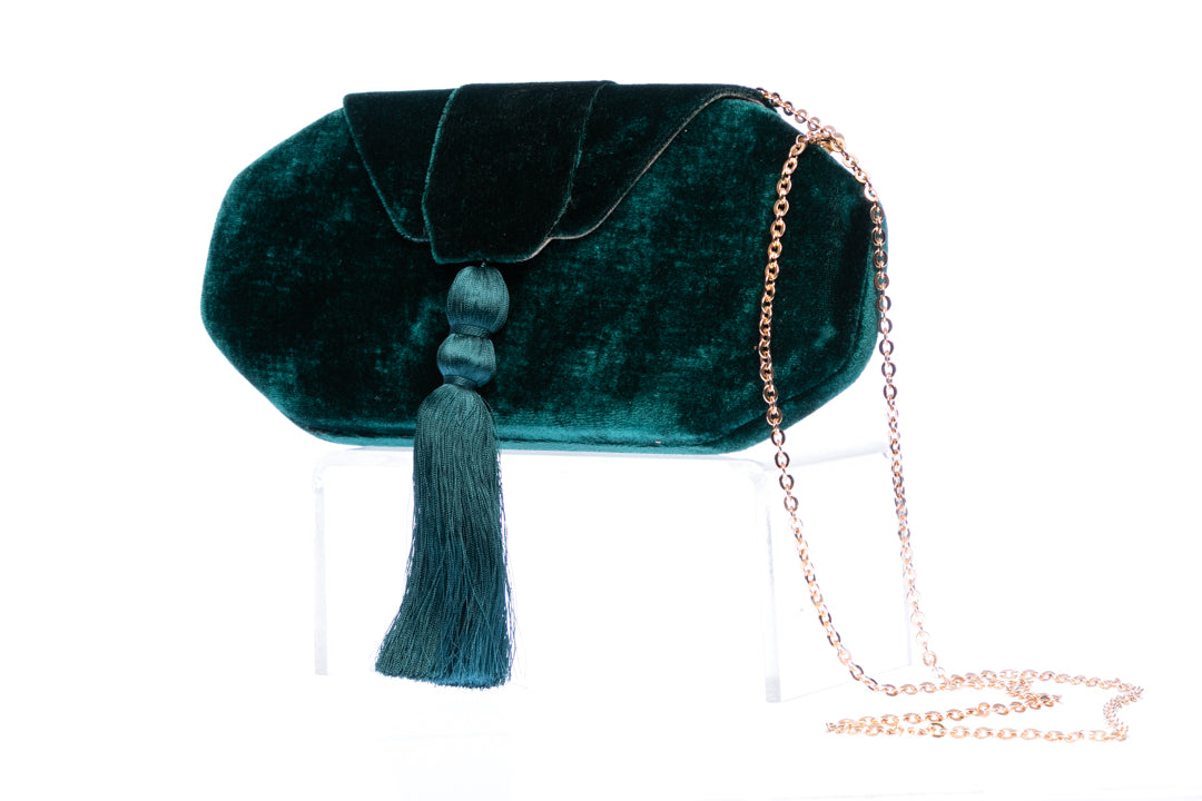 Velvet Evening Tassel Clutch with a silky tassel and brass chain strap, designed for evening events with a handmade, sophisticated finish.